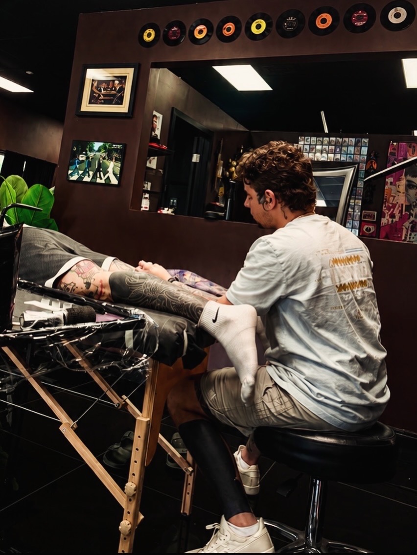 Tattoo artist working at Flawless Ink Gallery
