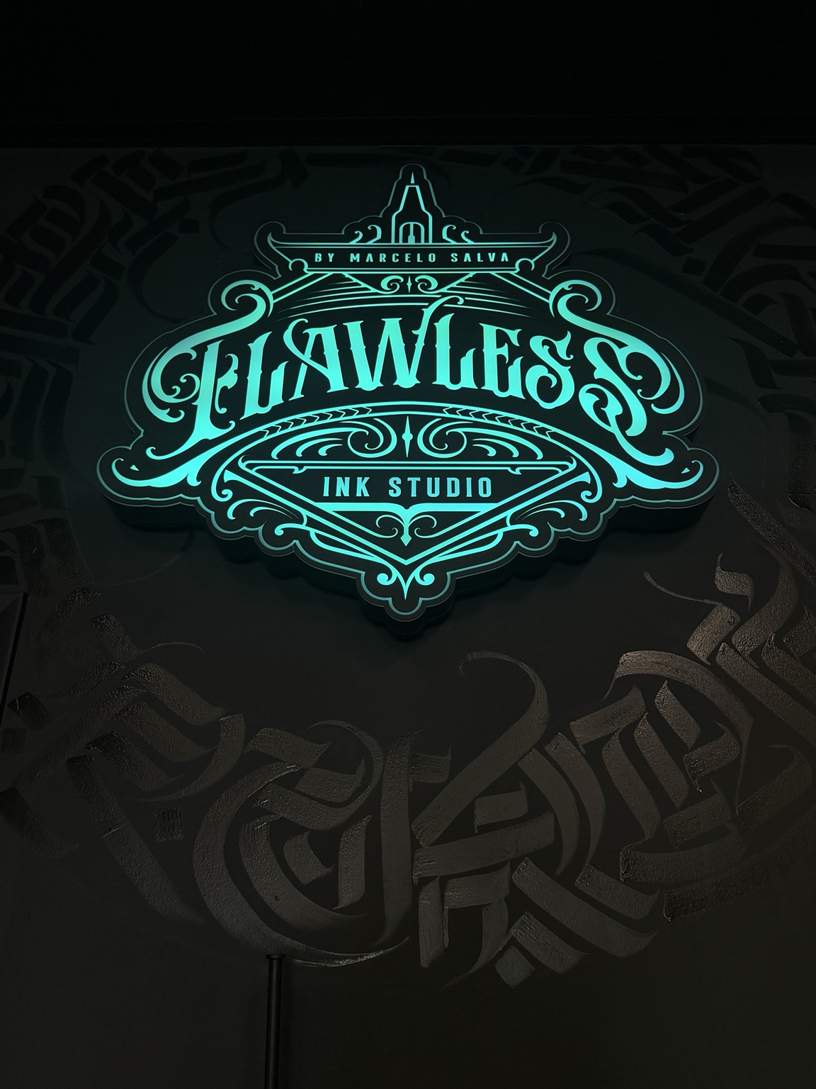 Flawless Ink Gallery illuminated logo