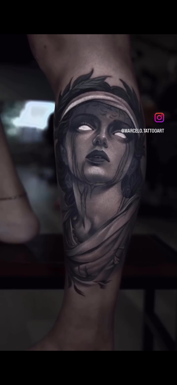 Black and grey portrait tattoo