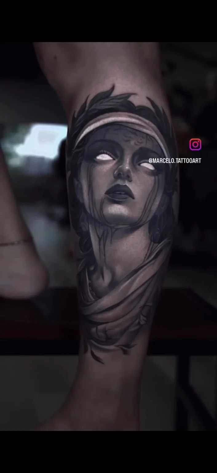 Black and grey portrait tattoo